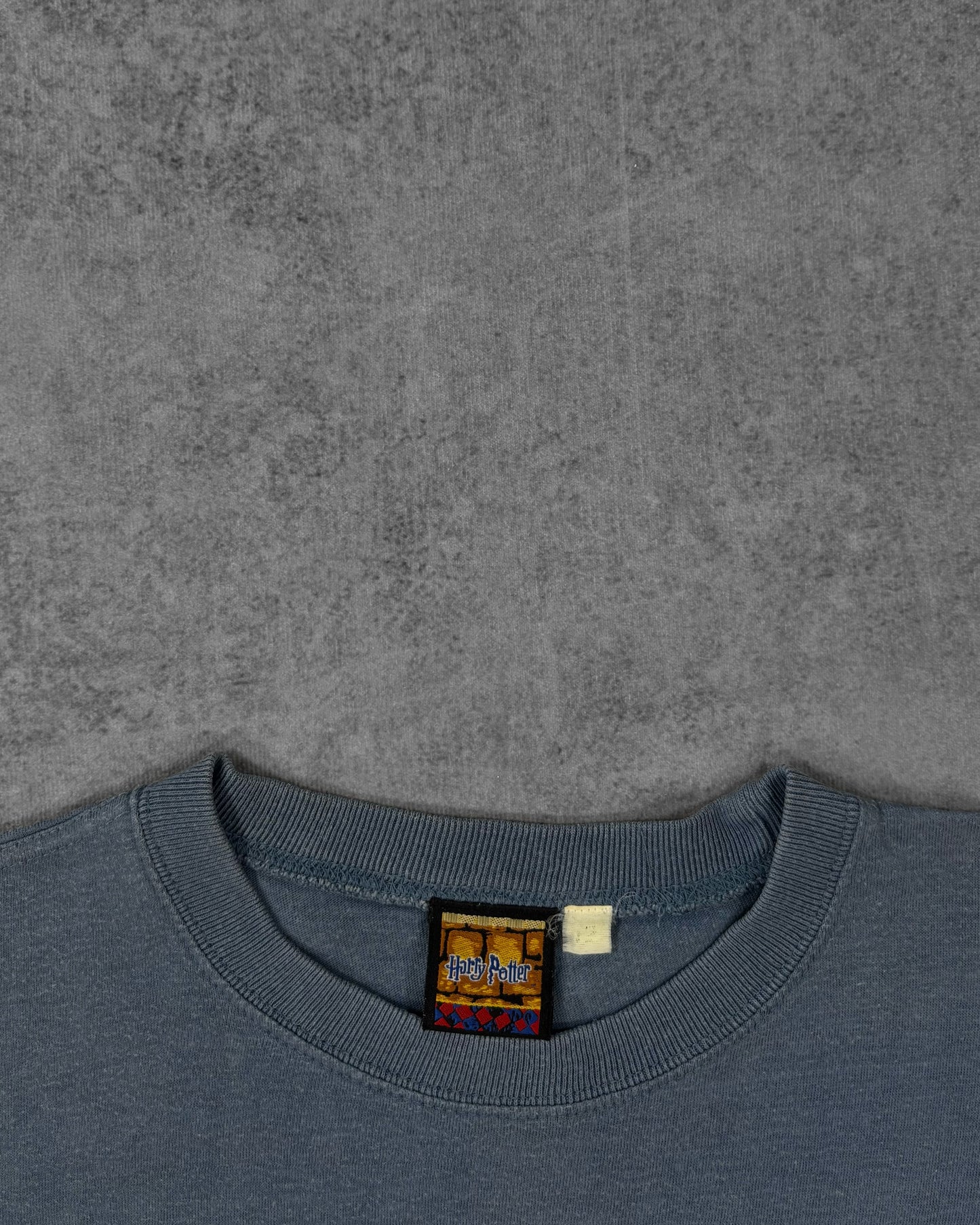 Label detail showing the neck tag on the Harry Potter Nimbus 2000 t-shirt