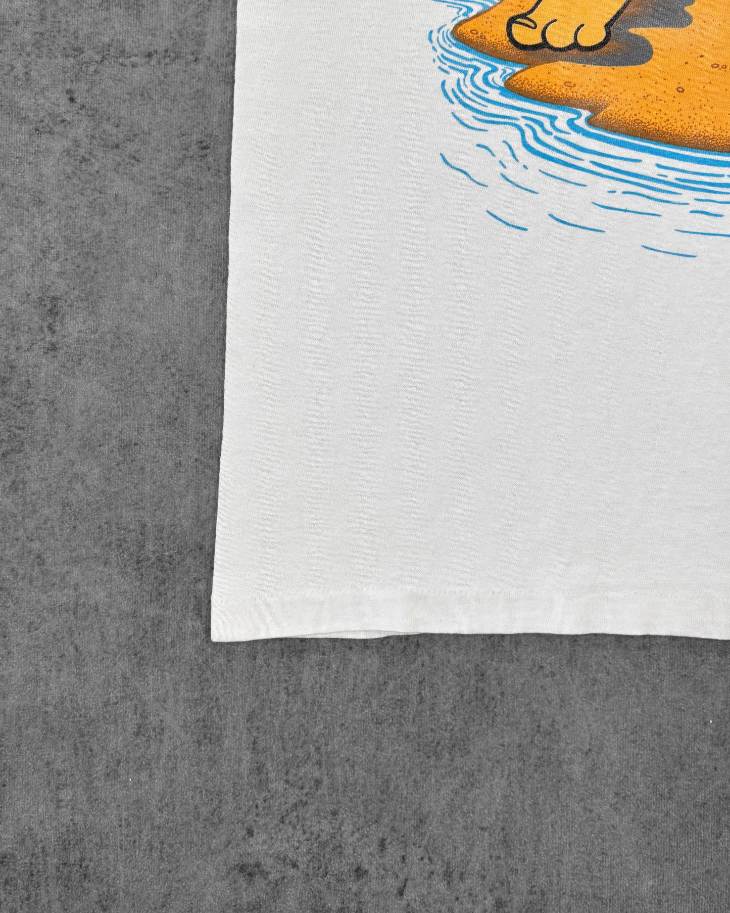 Stitching detail of the single stitch hem on the vintage Flintstones tee
