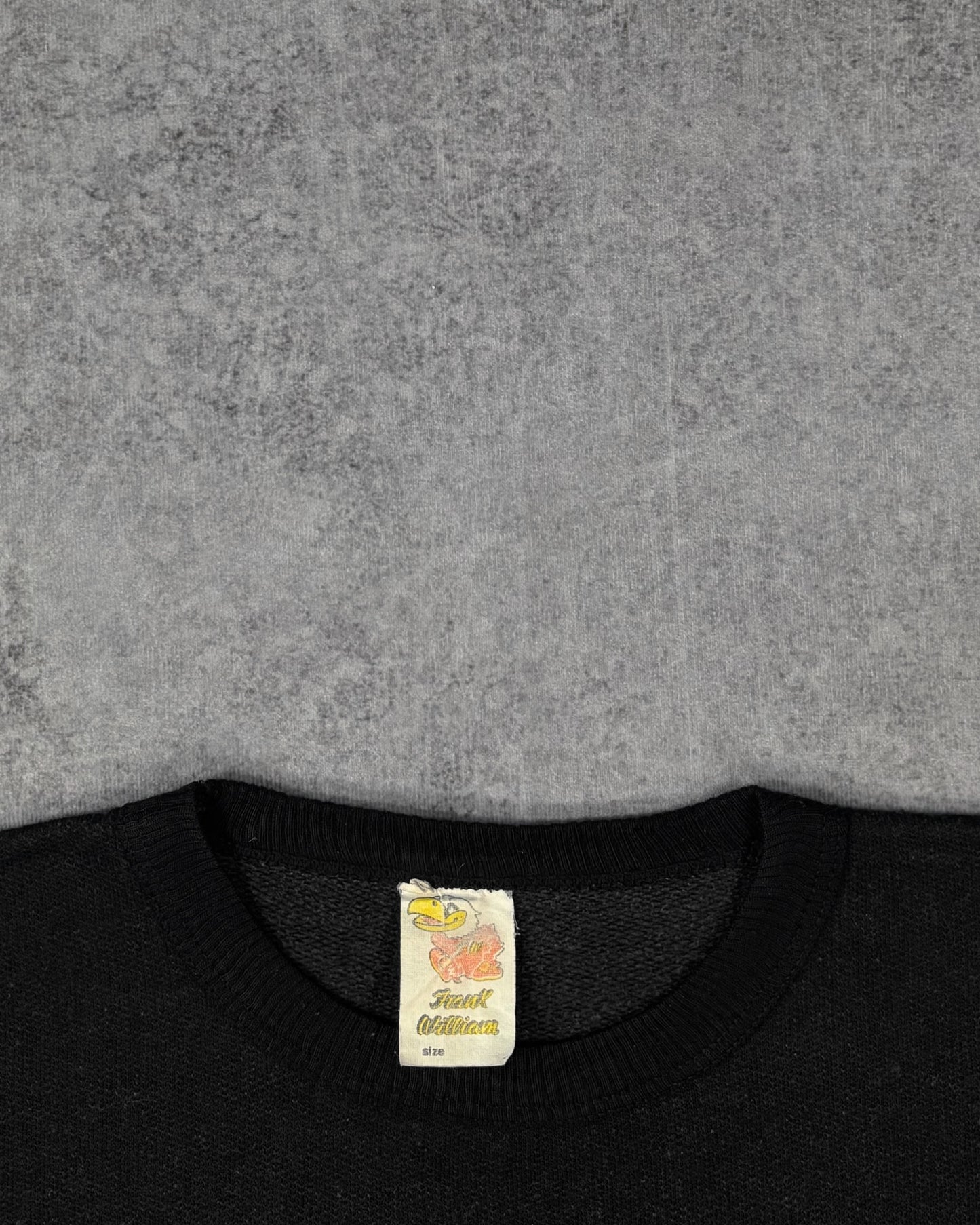 Label detail showing the illustrated Frank William neck tag on the vintage golf crewneck sweatshirt