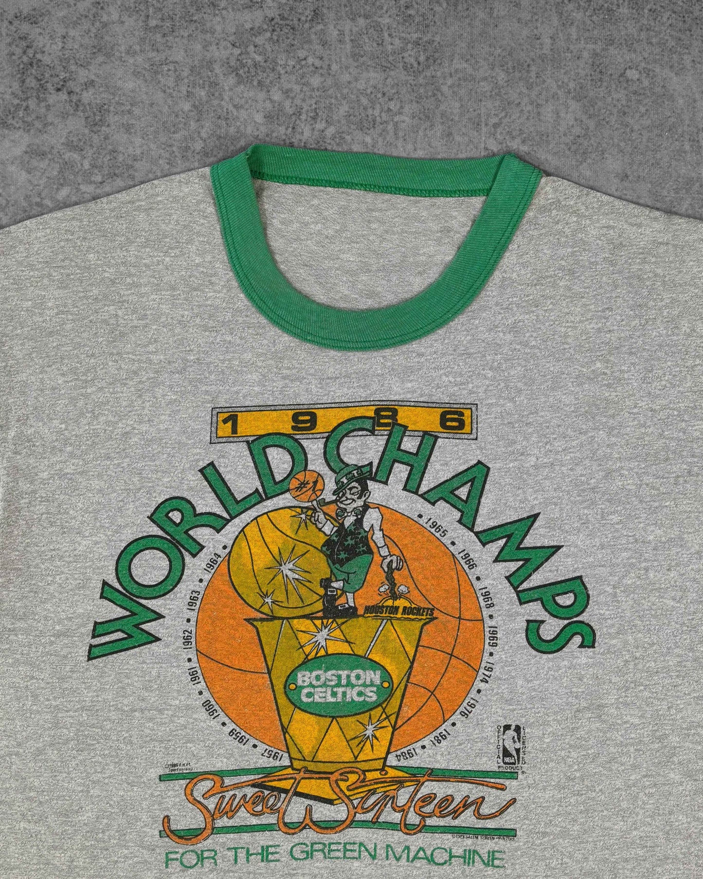 Vintage 1986 Boston Celtics ringer t-shirt, Celtics leprechaun and Larry O'Brien trophy graphic print detail