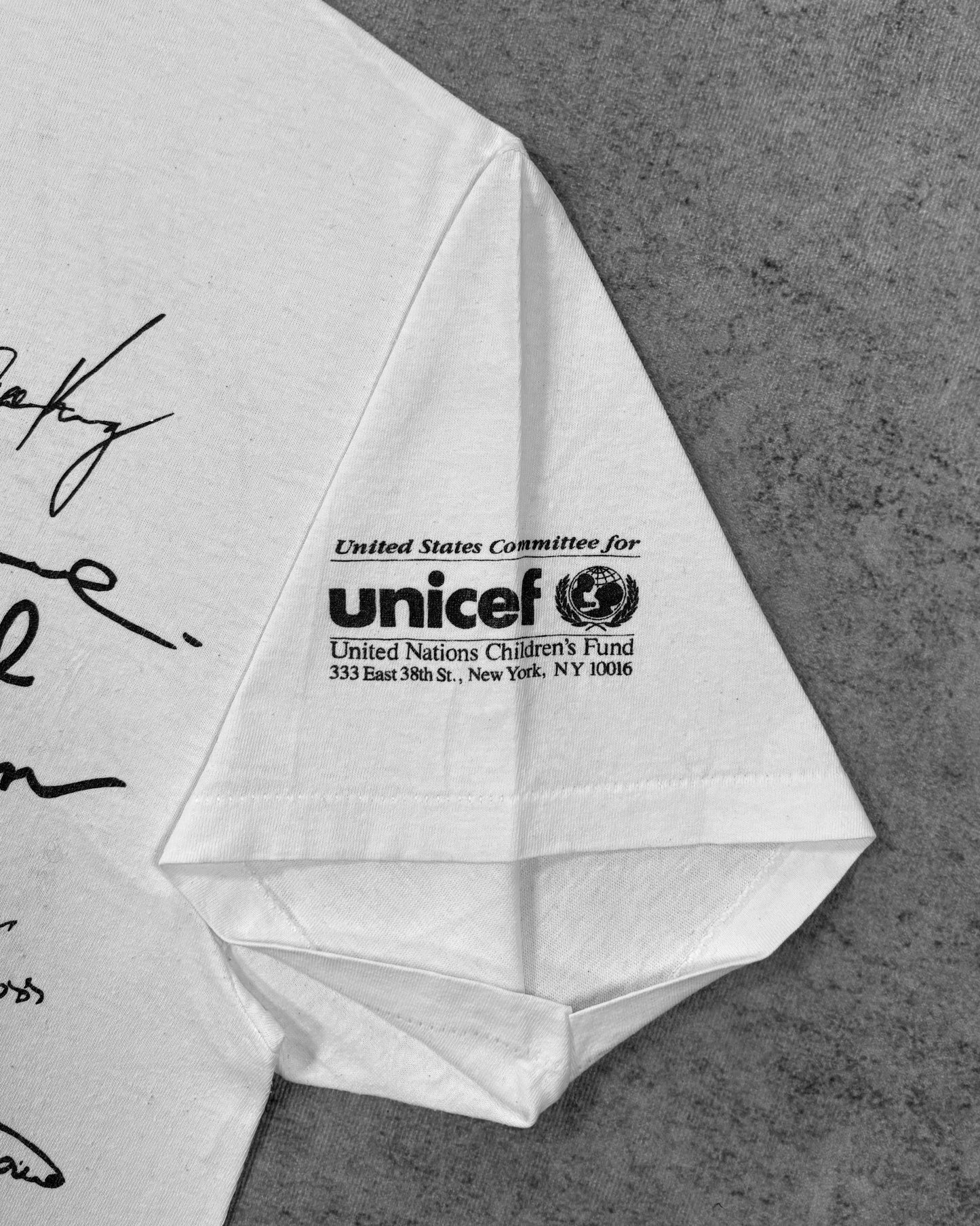 Label detail showing the Hanes neck tag on the vintage Olympic Aid t-shirt
