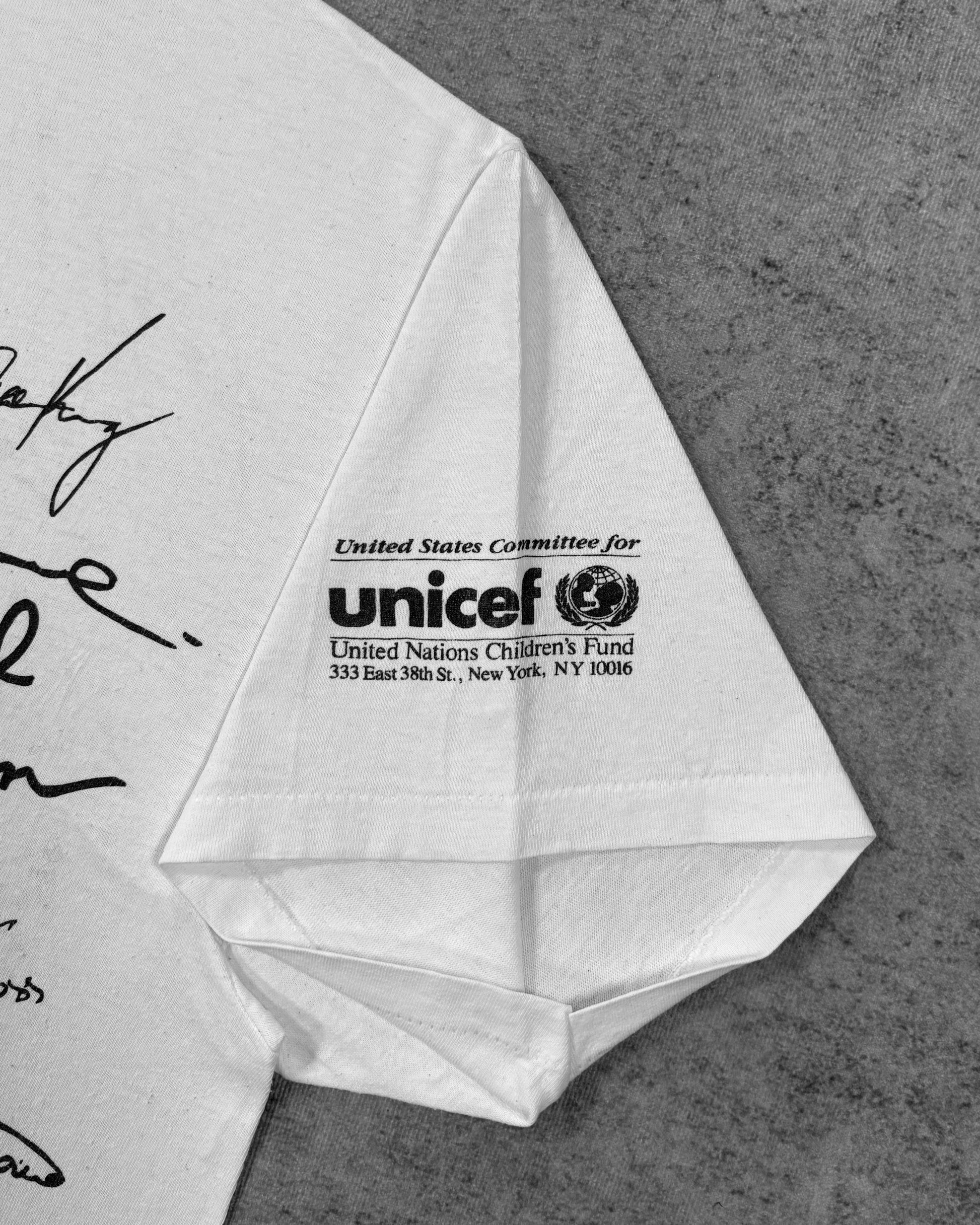 Label detail showing the Hanes neck tag on the vintage Olympic Aid t-shirt