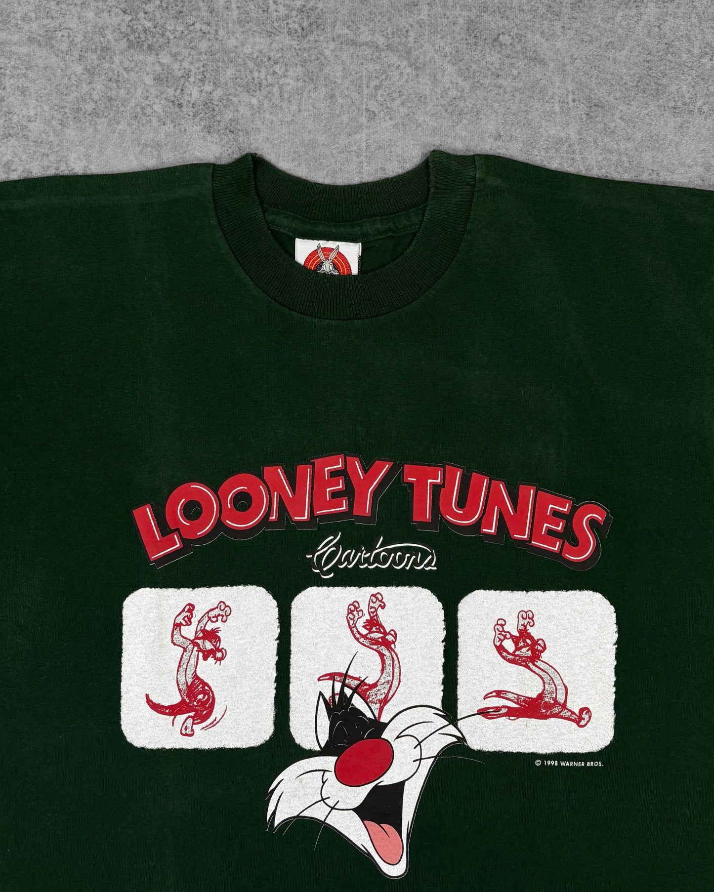 Close-up of Sylvester the Cat graphic print and Looney Tunes Cartoons lettering