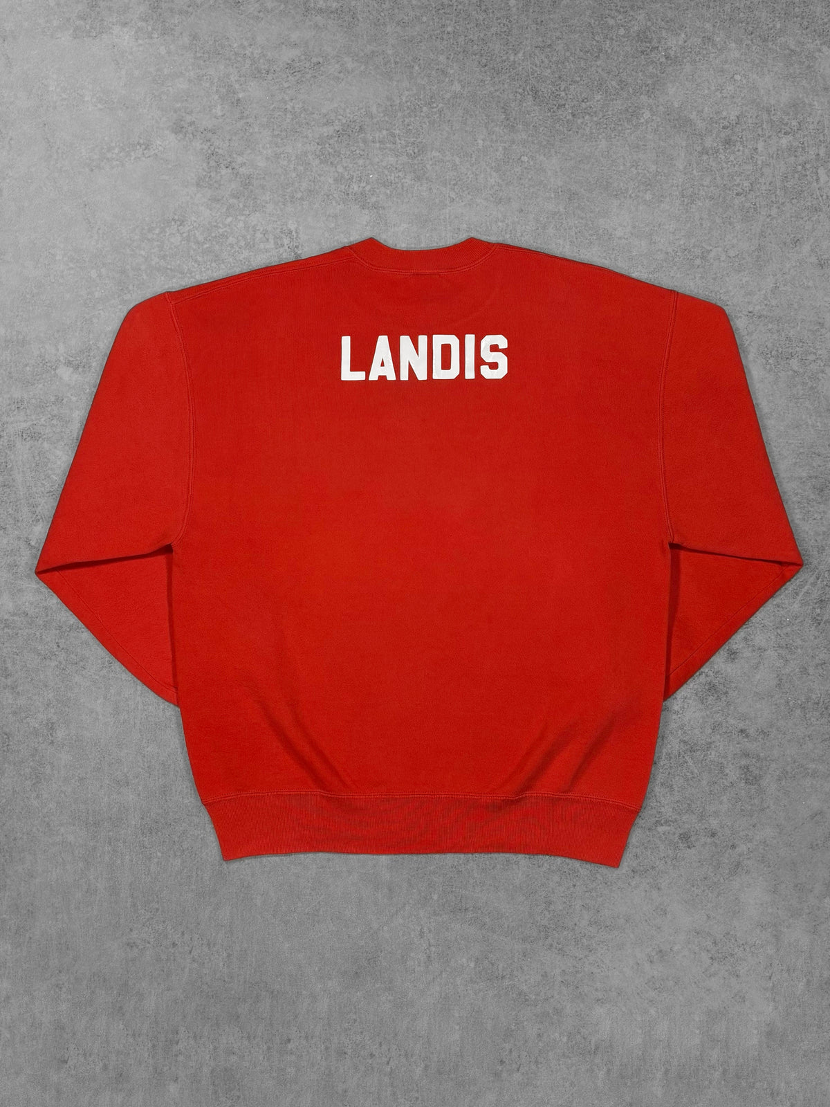 Vintage 1990s Russell Athletic red Tipp City Football sweatshirt – back view with LANDIS name print