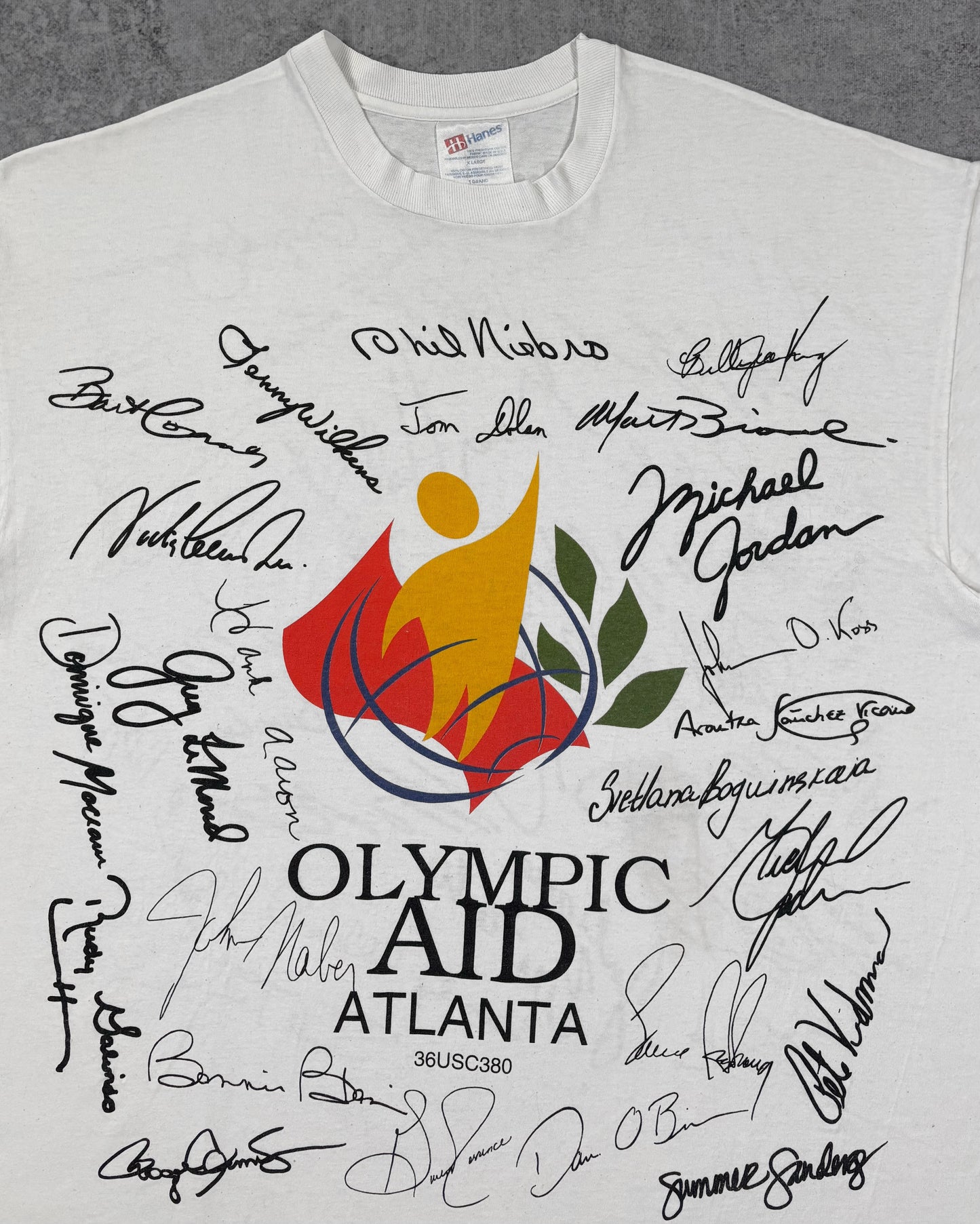 Print detail of the Olympic Aid logo and facsimile signatures including Michael Jordan on the front