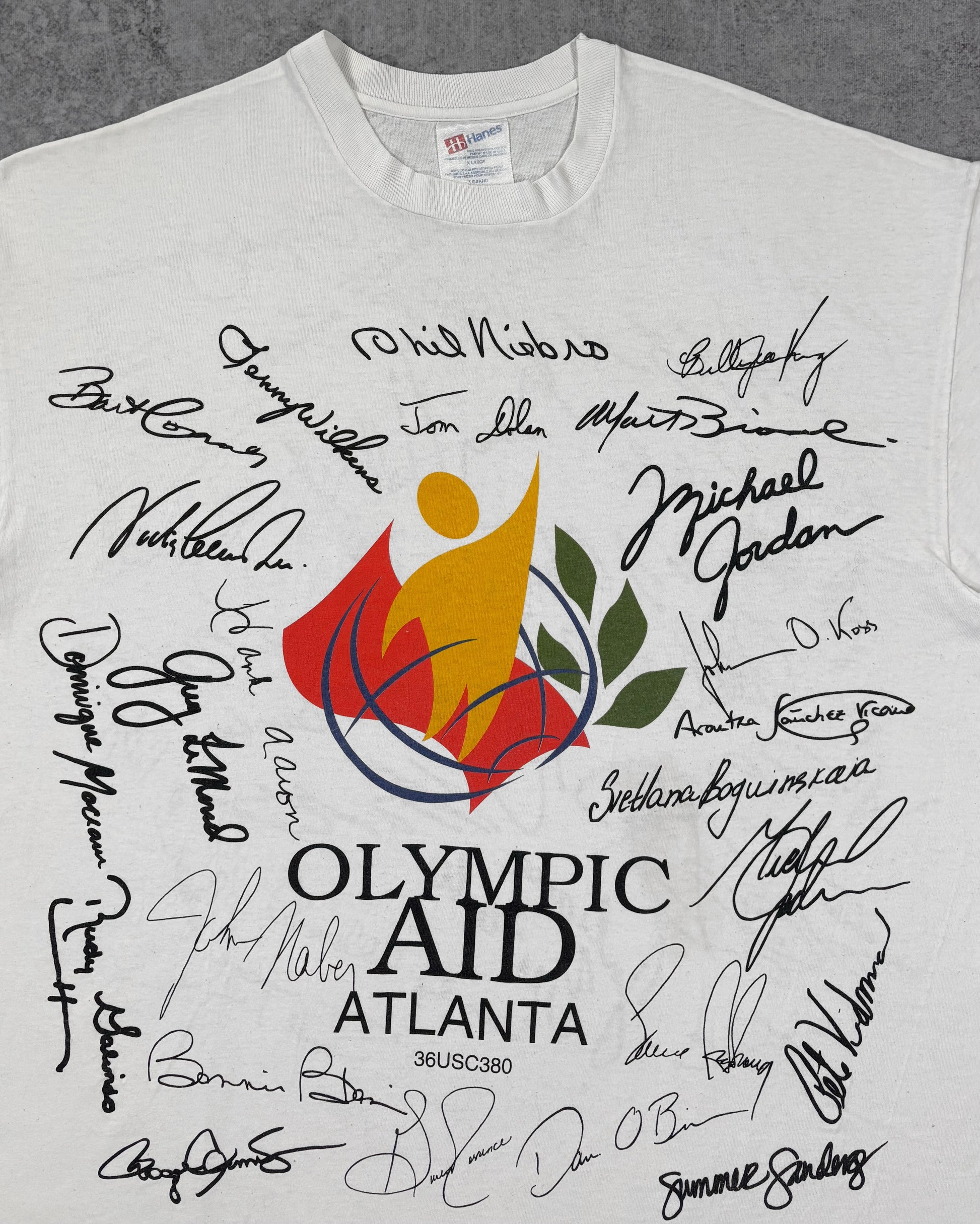 Print detail of the Olympic Aid logo and facsimile signatures including Michael Jordan on the front