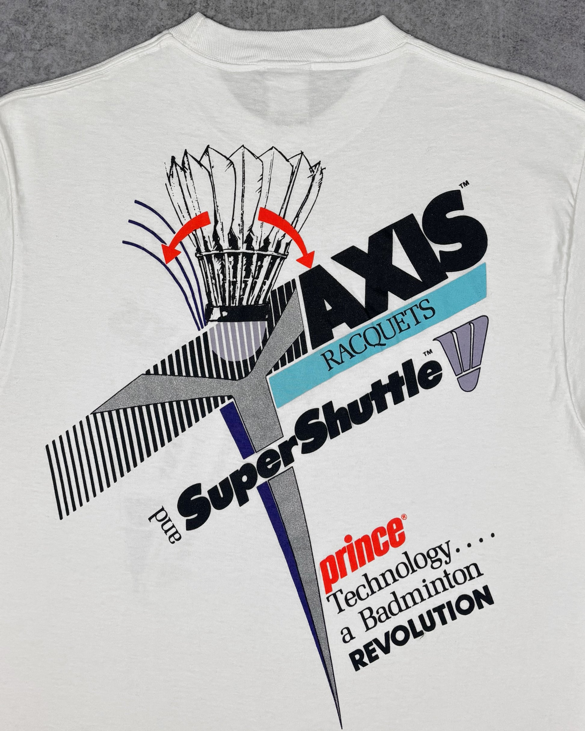 Print detail of the front chest graphic on the Prince AXIS badminton t-shirt