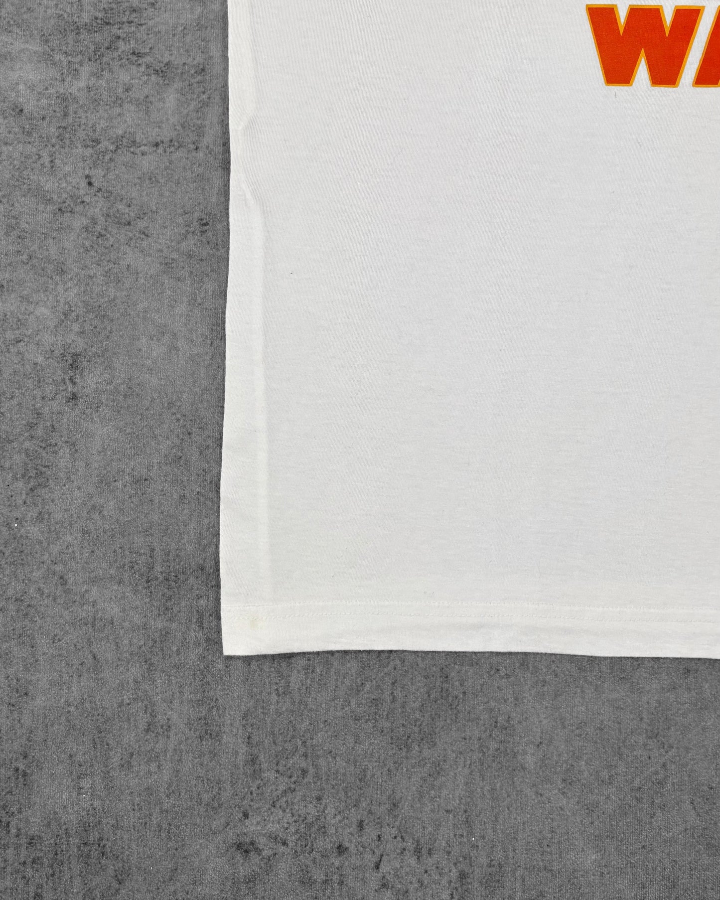 Stitching detail of the contrast ringer collar and sleeve trim