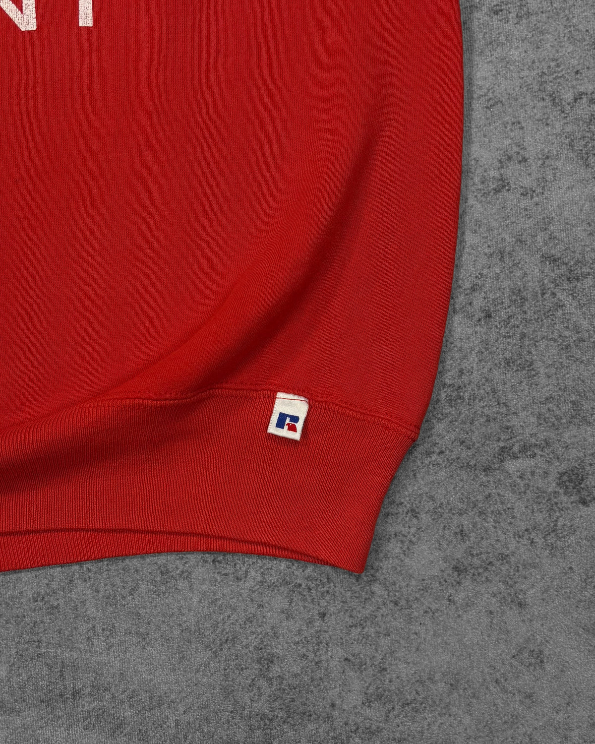 Vintage 1990s Russell Athletic red sweatshirt – stitched Russell eagle logo on hem detail