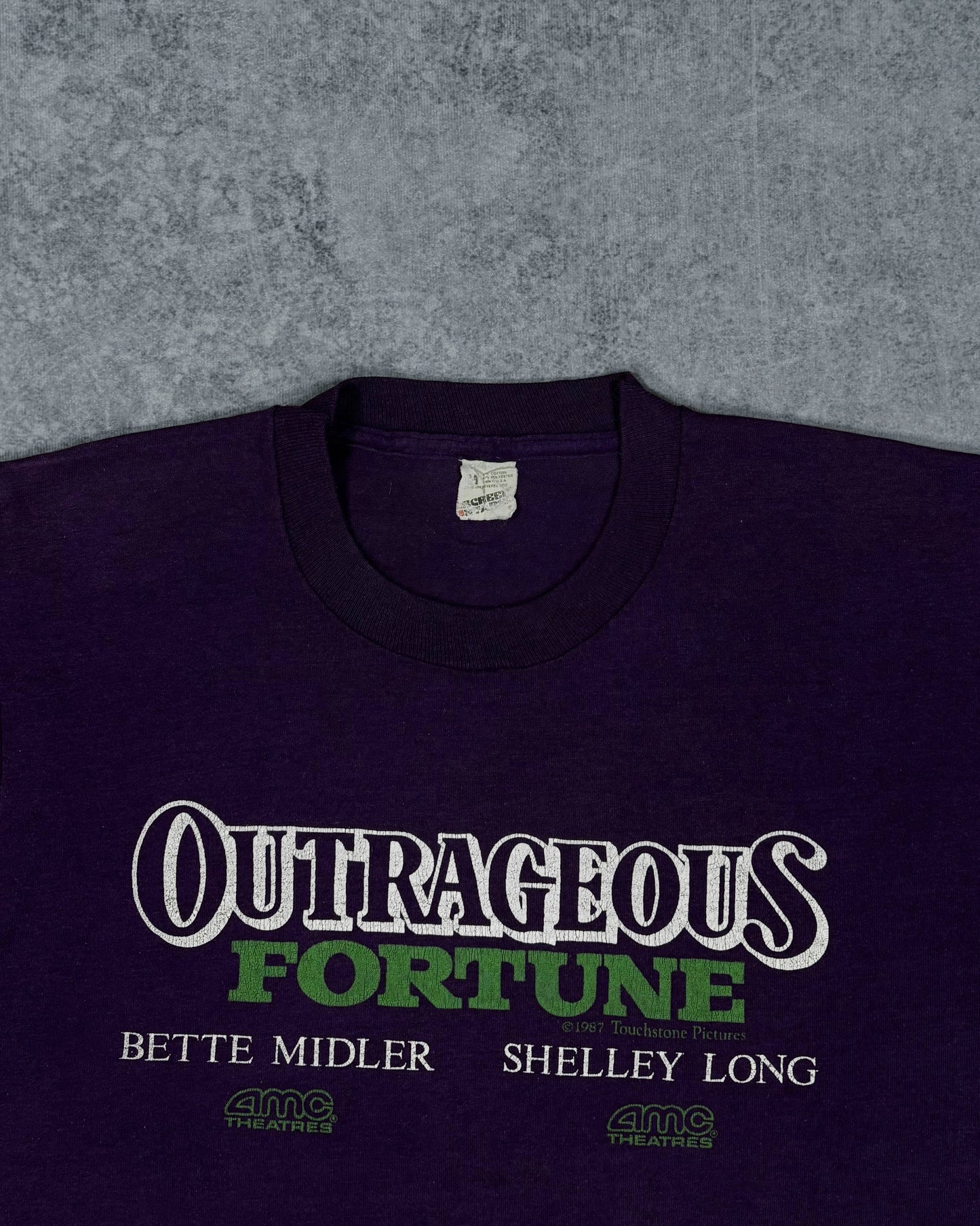 Outrageous Fortune 1987 movie graphic print detail, white and green