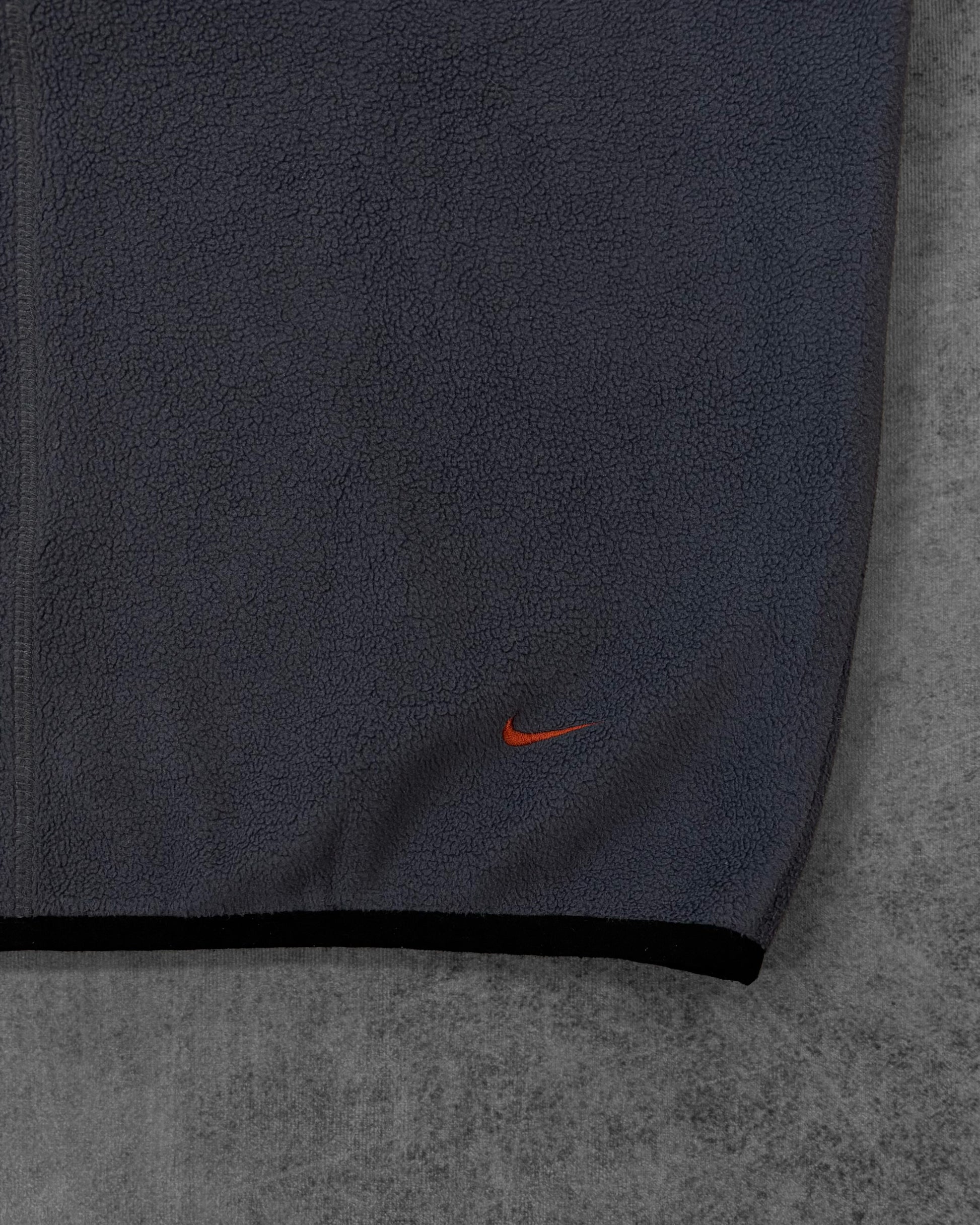 Detail of the vertical embroidered NIKE lettering on the sleeve