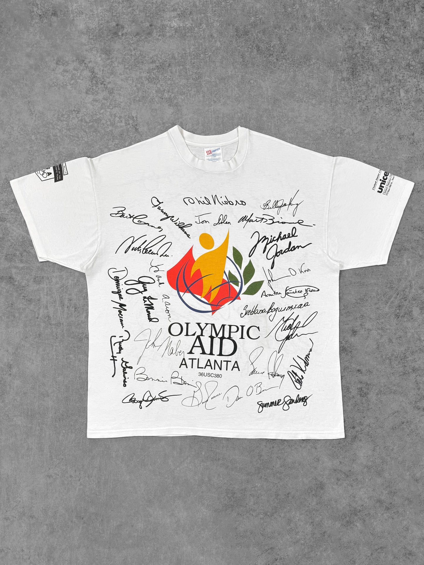 Front view of vintage 1996 Olympic Aid Atlanta Hanes t-shirt with multicolor signature print