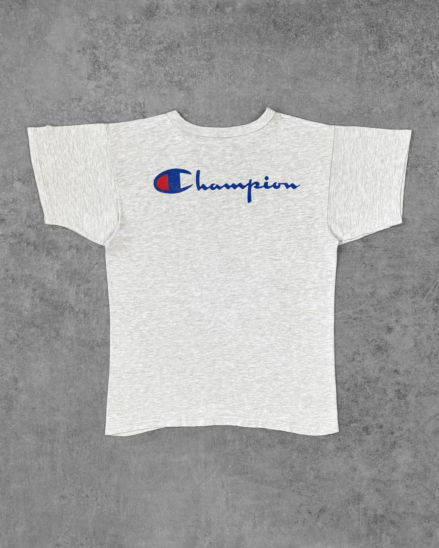 Back view of the Champion t-shirt showing the large Champion script logo in blue and red