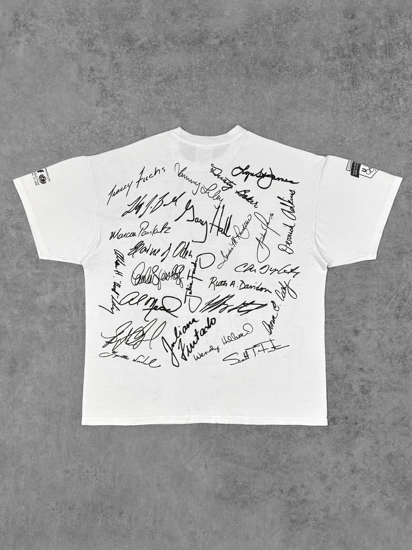 Back view of the Olympic Aid Atlanta t-shirt continuing the all-over signature print