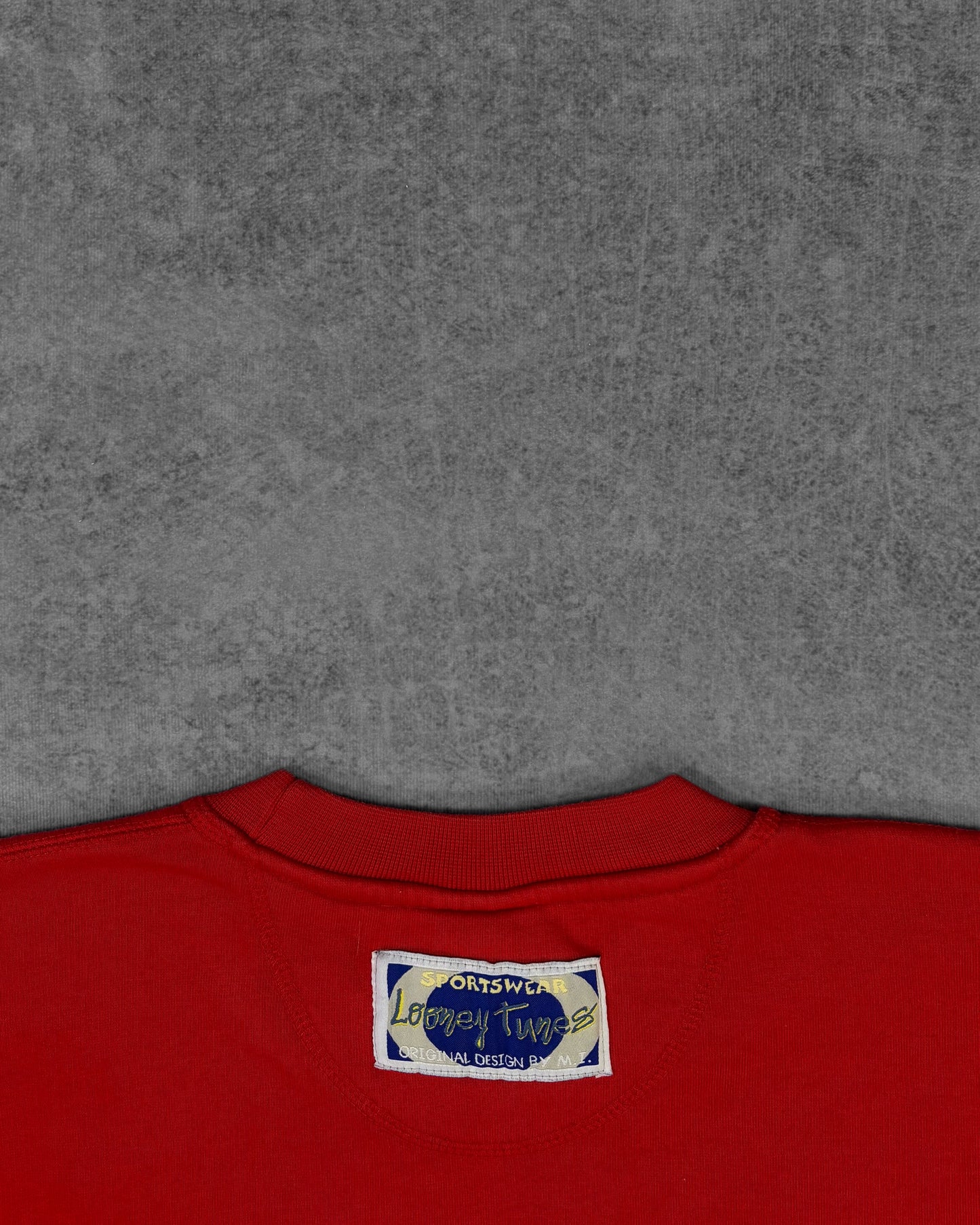 Licensing tag detail inside vintage 1998 Tweety crewneck sweatshirt