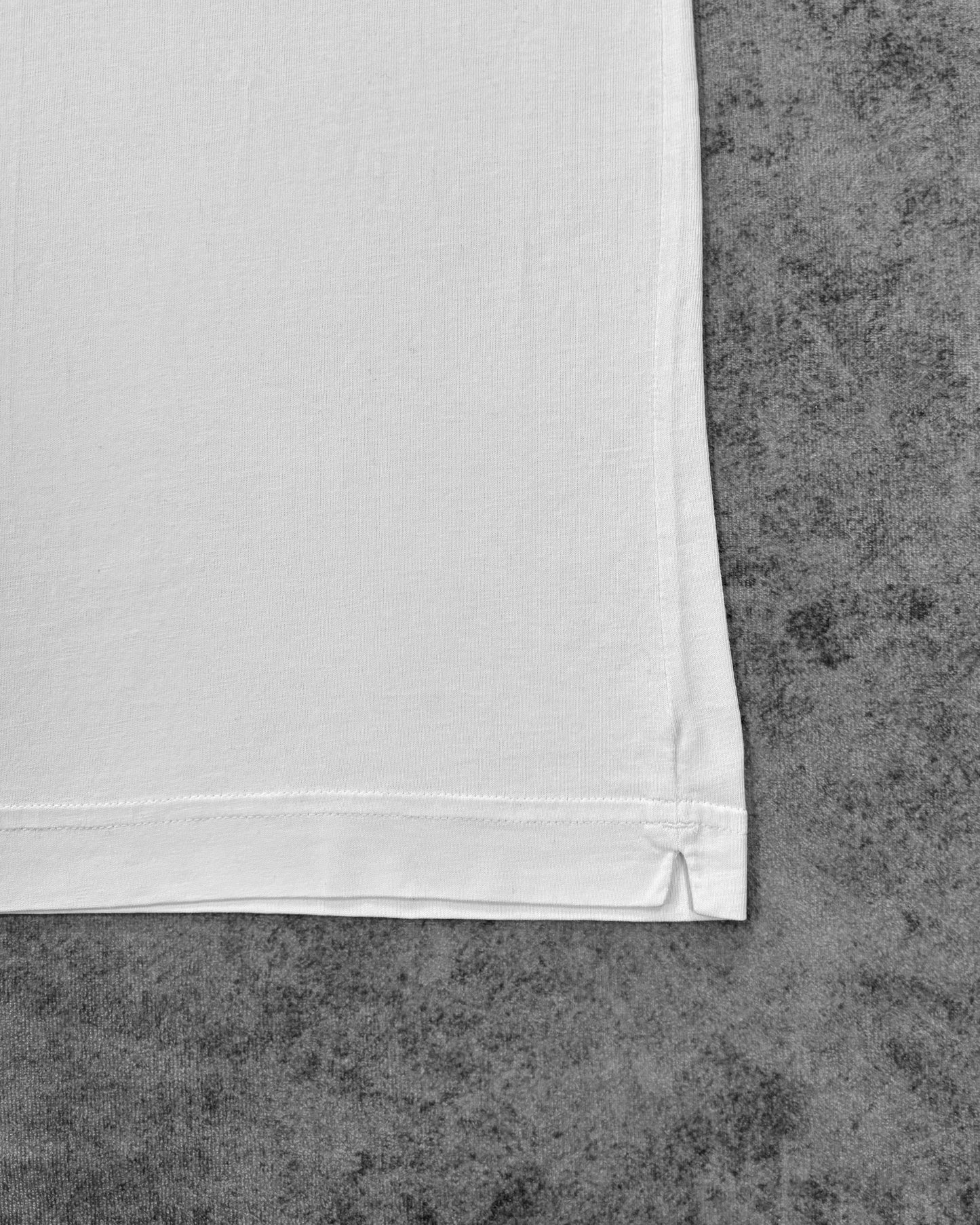 Fabric detail of the ringer t-shirt hem with coverstitch finish
